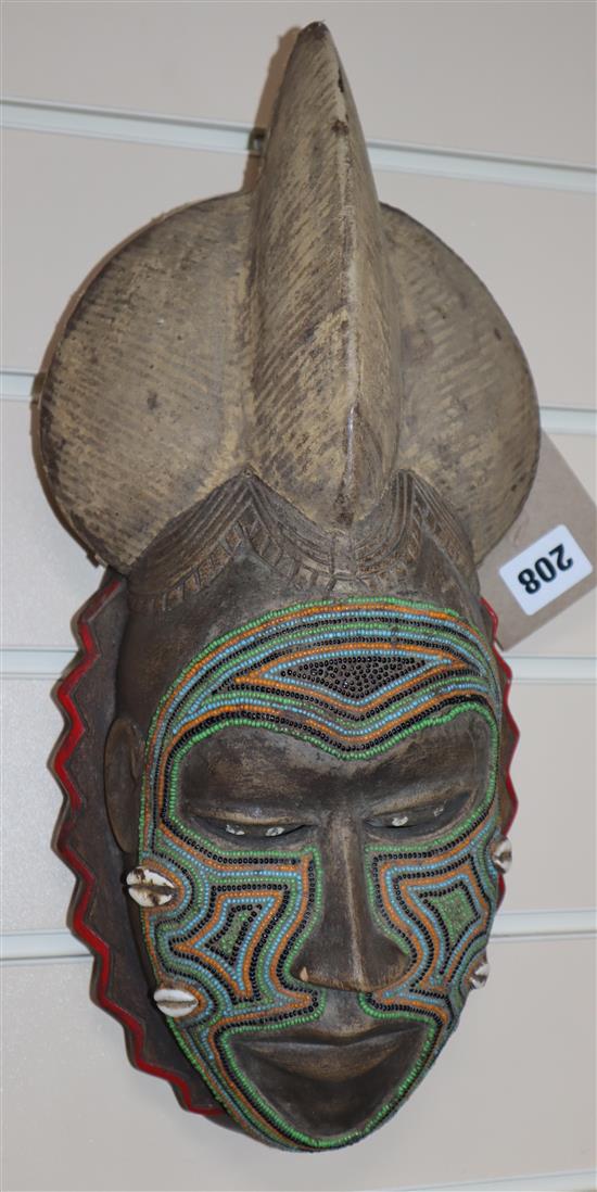 An African carved wood beadwork mask